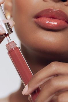 A first-of-its-kind skincare hybrid lip gloss that has the high shine of a gloss with zero stickiness. Packed with nutrients and hydrating plant-based botanicals including mango seed butter, avocado, grapeseed and coconut oils. This lip gloss-lip balm hybrid soothes, nourishes and protects your lips. INGREDIENTS: Hydrogenated Poly(C6-14 Olefin), Persea Gratissima (Avocado) Oil, Ethylene/Propylene/ Styrene Copolymer, Limnanthes Alba (Meadowfoam) Seed Oil, Octyldodecanol, Bis-Diglyceryl Polyacylad Lip Gloss Model Photography, Lip Product Photoshoot, Make Up Products Photography Cosmetics, Cosmetic Product Shoot, Lip Gloss Business Photoshoot Ideas, Makeup Products Aesthetic Photography, Makeup Product Shoot, Lip Product Photography, Lip Gloss Photography