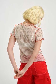 This playful polka dot mesh tee is perfect for layering under dresses or wearing over a cute bra and has eye-catching red topstitching. have fun with this quirky and versatile piece.    - 100% polyester    - bold red topstitching    - slips on over head    - wash in cool water and lay flat to dry    - made in canada Eliza Faulkner, Cute Bra, Cropped Flare Pants, Seersucker Dress, Cute Bras, Sweater Jumpsuit, Denim Outerwear, Montreal Canada, Under Dress