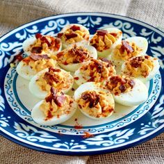 deviled eggs on a blue and white plate