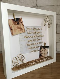 a white frame with gold foil and some pictures on it