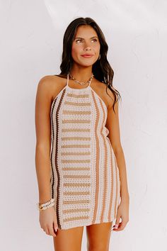 – Soak up the sun in our new stunning dress – Lightweight loose knit material in brown hued stripe pattern and a full soft liner – Flirty high halter tie neckline with an open upper back – Flattering figure hugging silhouette that falls into a straight hemline Measurements S : Bust 28", Hip 32", Length 27", Waist 26". M : Bust 30", Hip 36", Length 27.5", Waist 28". L : Bust 34", Hip 38", Length 28", Waist 30". Hugging Silhouette, Soak Up The Sun, Crochet Mini Dress, Loose Knit, Knitting Materials, Stunning Dresses, Stripes Pattern, The Sun, Mini Dress