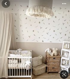 a baby's room with two cribs, a bed and a dresser