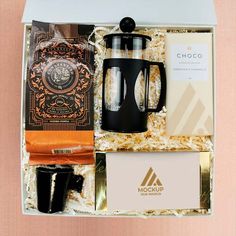 the coffee gift box is packed with two mugs