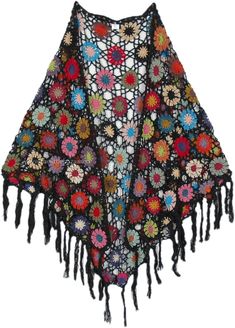 a crocheted shawl with flowers and fringes