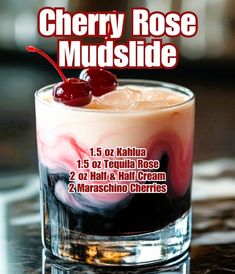 the cherry rose mudslide is served in a glass with ice and cherries