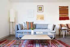 a living room filled with furniture and rugs