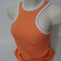 Sport Illustrated Medium Orange Stripe Top Color: True Tangelo/ White Size: Medium Stretch 93% Rayon 7% Spandex 25” L X 16” Armpit To Armpit Closure Type: Pullover Head Fit: Fitted Neckline: Halter Neck Sleeve Length: Sleeveless Apparel Length: 24 Inches Fiber Content: 93% Rayon, 7% Spandex Fabric Description: Rib Care: Machine Wash, Tumble Dry Plaid Tank Top, Calvin Klein Jeans Women, Solid Tank Tops, Scoop Neck Tank Top, Stripe Top, Flowy Tank Tops, Vest White, Blue Tank Top, Ribbed Tank Tops