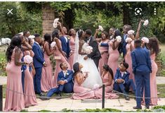 a bride and groom are surrounded by their bridal party