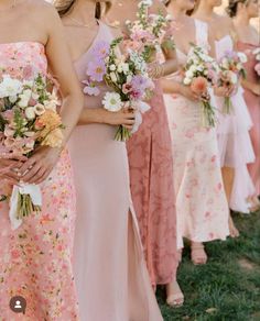 the bridesmaids are all wearing pink dresses and holding bouquets in their hands