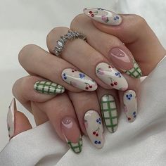 These nails feature a delightful summer design with a mix of white and green backgrounds adorned with colorful cherry and blueberry patterns, combined with a chic green plaid accent. Perfect for a fresh, fruity summer vibe!  🌸Click on the image to shop our Korean Gel Nail Polish Collection.  🌸Credit: prettywth.julia on Instagram 🌸Summer nails, fruit nail art, cherry nails, blueberry nails, plaid nail design, fresh nail art, Korean gel polish, green and white nails, summer manicure, trendy nail designs. Cute Summer/fall Nails, European Nails Summer, Christmas Summer Nails, Fun Work Nails, Blueberry Nails Art, Cool Green Nails, Picnic Nail Art, Gingham Nail Art