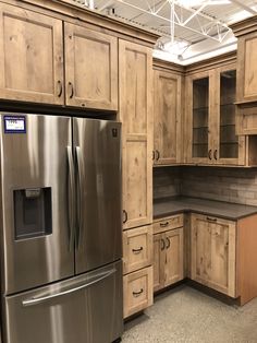 a kitchen with wooden cabinets and stainless steel appliances