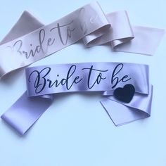 "- Please note that the pin shape and colour will be selected randomly depeding on the stocks. Heart or diamond shaped pins will be sent in gold, silver, black or white colour.Bride to be sash, Purple bachelorette sash, Hen party sash with pin, Bridesmaid gift, Bachelorette party favor, Personalised lilac hen sash - A very classy hens party sash with black \"Bride to be\" print on double face satin ribbon. - You can personalise this sash with your own colors and wording - It is open ended and co Purple Bachelorette, Purple Bachelorette Party, Bride To Be Decorations, Classy Hen Party, Hen Party Sash, Bachelorette Party Accessories, Gold Bachelorette, Bachelorette Sash, Gift Bachelorette Party