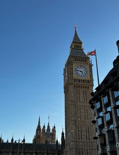 the big ben clock tower towering over the city of london