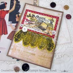 an old fashion card with buttons and laces on it, next to some sewing supplies