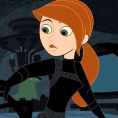 the animated character is dressed in black and has long red hair, with green eyes