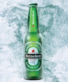 a bottle of heineken beer in the snow