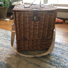 a brown wicker bag sitting on top of a rug