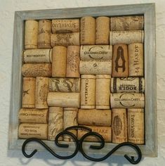 a wine cork wall hanging on the side of a wall