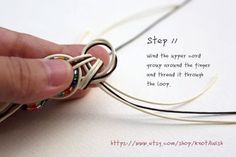 a hand holding a piece of string with the words step 1 written on it