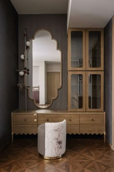 an elegant dressing room with marble stools and large mirror