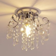 a chandelier hanging from the ceiling in a room