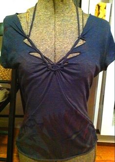 a mannequin wearing a purple top with cutouts on it's back