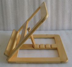 a wooden stand with two handles and one handle on it, sitting on top of a white