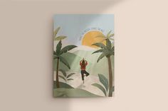 a book with an image of a person doing yoga in the middle of palm trees