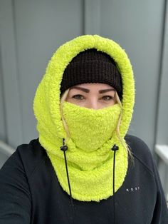 Balaclava - Sherpa FITS OVER HELMET! Fits over most adult helmets as well as over beanies  Hood made with Sherpa fleece Stay warm in style!  Wear with hood up or down, and face mask up or down  Pull strings with cord stops to stay tight  Adult size, fits most!  Beanie hat not included  100% polyester   Dry clean only!  *Pattern placement may vary Casual Full Face Windproof Hat, Windproof Hats For Outdoor Winter Wear, Windproof Winter Hats For Outdoor, Winter Wear Windproof Hats For Outdoor, Warm One-size Hooded Balaclava, Winter Solid Balaclava With Fleece Lining, Hooded Outdoor Hat, One Size Fits Most, One-size Hooded Balaclava For Cold Weather, One Size Hooded Balaclava For Cold Weather