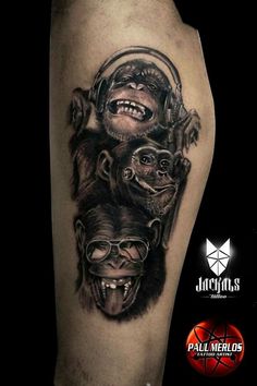 a tattoo with three monkeys on it's arm and one monkey in the middle