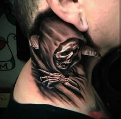 a man's neck tattoo with a skeleton on it