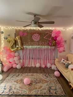 a room decorated with balloons and decorations for a 21st birthday party in pink, gold and white