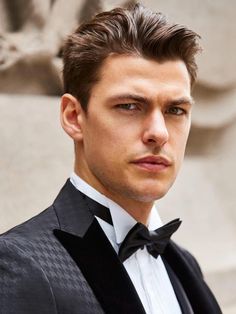 a man in a tuxedo and bow tie