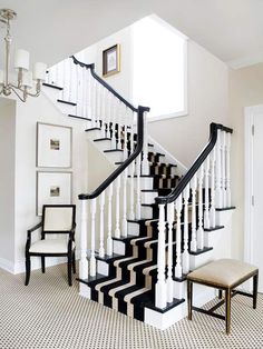 a black and white staircase in a house