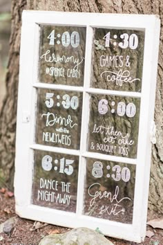 an old window is decorated with numbers and date signs for the wedding day, as well as dates