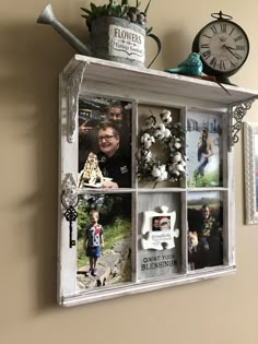 an old window is decorated with family photos and other things to decorate on the wall