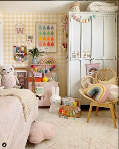 a child's bedroom decorated in pastel colors