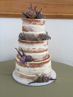 a three tiered cake sitting on top of a table