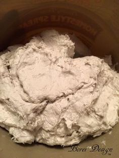 a bowl filled with white powder sitting on top of a table