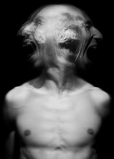 an image of a man with no shirt on and his mouth open in the dark