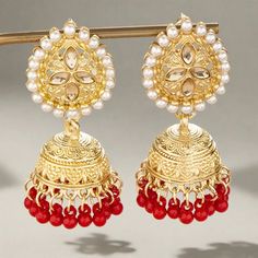 The versatile Cassie Jhumka Earrings are the ideal addition to any collection. Featuring just the right size and delicate details, these earrings can be dressed up or down to suit your style. Embrace their versatility and elevate any outfit with this must-have accessory. *This Product takes a Minimum of 30days to Ship* Festive Dangle Jhumkas, Red Latkans Earrings For Diwali, Elegant Red Jhumkas For Festive Occasions, Red Dangle Danglers With Latkans, Festive Plug Earrings For Festivals, Red Danglers With Latkans For Festive Occasion, Red Danglers For Diwali, Red Latkans Drop Earrings Danglers, Red Bollywood Jhumkas With Latkans