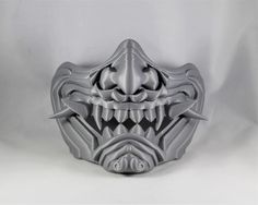 This is a raw 3D print of our interpretation of an Oni Mask. These masks are printed in PLA and have some ruffs spots just from the 3D printing process itself. Typical finishing work will be needed to be done to get them smooth. Color of print may vary from photo shown. These masks come with no padding, straps, Velcro or magnets. PLEASE MEASURE YOUR HEAD BEFORE PURCHASING. If the mask doesn't fit the buyer, resale of the helmet is up to them. We do not issue refunds. Oni Maske, 3d Print Shop, Darth Vader Face, Leather Leggings Fashion, Japanese Mask, Oni Mask, Mask Tattoo, Wall Mask, Cool Masks