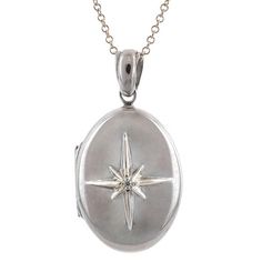 Centering an eight point star set with a Round Brilliant cut diamond weighing approx. 0.02ct, on a Sterling Silver of 18k yellow gold & Sterling Silver locket measuring approx. 1 1/8 x 5/8 inch. Suspended from a Sterling Silver chain 16 inches. Oval Locket Necklace Silver, Star Locket Necklace, Silver Locket Aesthetic, Formal Star-shaped White Gold Jewelry, Formal White Gold Star-shaped Jewelry, Formal White Gold Star Jewelry, Classic Silver Star-shaped Jewelry, Silver Star-shaped Jewelry With Single Cut Diamonds, Silver Star-shaped Formal Jewelry