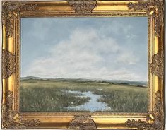 an oil painting of grass and water in a gold frame