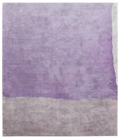 a purple and white rug with an area in the middle that has been made into a rectangle shape