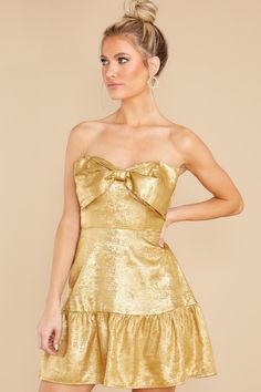 Darling. you're looking so Fun And Festive we may mistake *you* for a gift under the tree! *wink* You are looking so dazzling in this gold dress. this may be a new classic look... Strapless dress features a bow detail. ruffle hem. elastic back. and a side zipper. Model is wearing a small. • 100% Polyester • Hand Wash Cold • Lined • Imported Sorority Rush Dresses, Rush Dresses, Fit And Flare Skirt, Under The Tree, Bow Detail Dress, Holiday Party Dresses, Little White Dresses, Hoco Dresses, Princess Seam