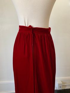 Vintage Dark Red Velvet Maxi Skirt 1970's 70's Red Velvet Gothic Full Length High Rise Skirt. In great condition! No tags on this item, but would best fit a 24 inch waist. Measurements are taken while garment is laid flat and are as follows: Waist: 12 inches Hip: 17 inches Length: 42 inches Red Lined Skirt For Evening Wear, Vintage Red Skirt For Party, Vintage Full-length Lined Skirt, Vintage Full Skirt For Party, Vintage Red Bottoms For Party, Vintage Red Party Skirt, Vintage Party Lined Skirt, Vintage Red Full Skirt Bottoms, Vintage Red Lined Skirt