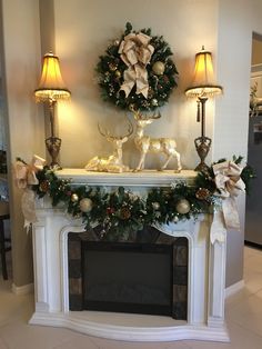 a fireplace decorated with christmas decorations and lights