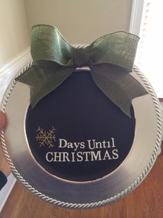 someone is holding up a christmas ornament that says days until christmas