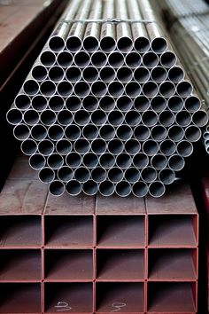 several metal pipes stacked on top of each other